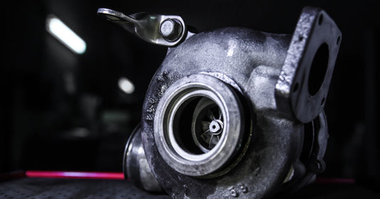 Close-up of a turbocharger in a car engine, highlighting precision engineering and high-performance power.