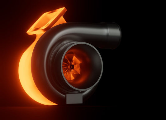 A turbocharger is in front of a black background. One side of the turbocharger glows red with heat flowing through it.